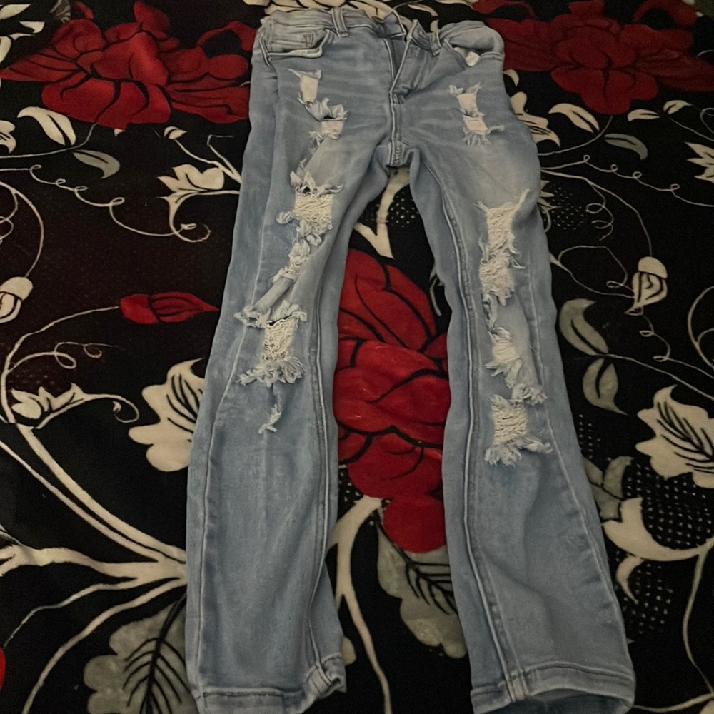 Light washed ripped jeans.